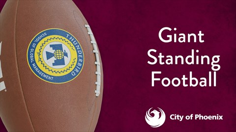 Giant Football standing tall